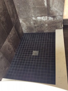 Finished upgraded shower floor with blue tiles