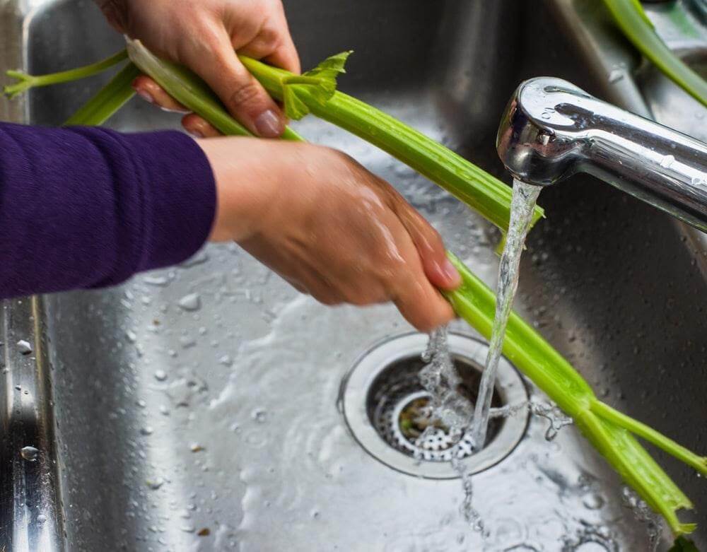Cleaning veggies in sink
